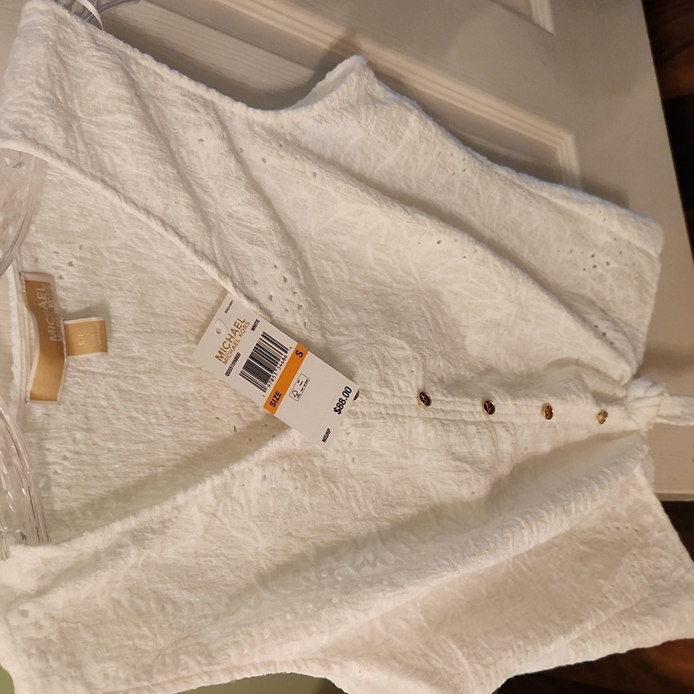 New with tag, Michael Kors Ivory Textured Sleeveless Blouse.